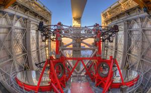 An image of the LBT with two 8.4 m primary mirrors inside the observatory enclosure.