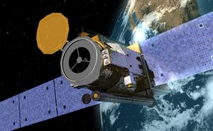The Hinode satellite with three telescopes above the Earth.