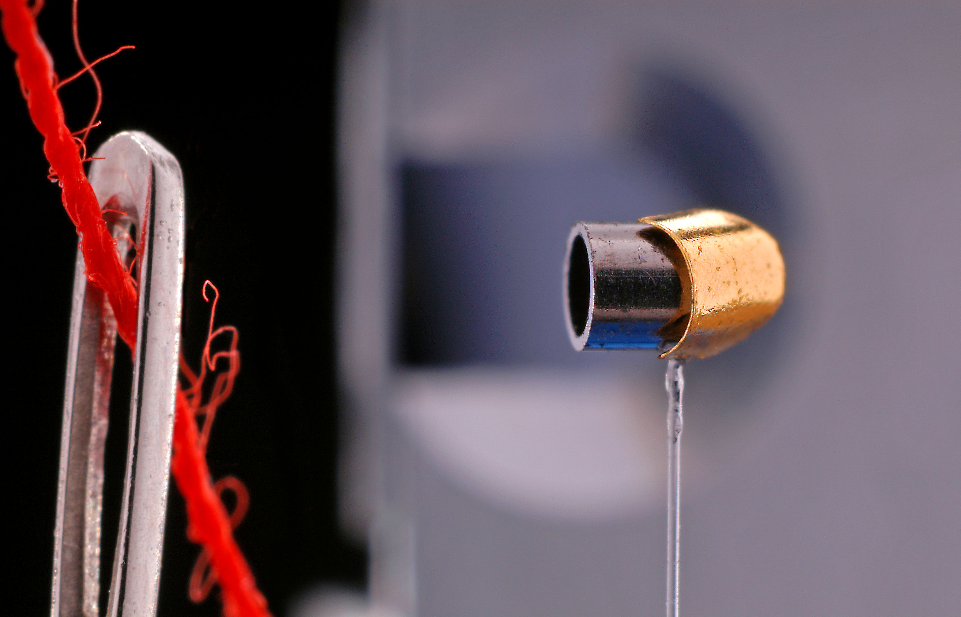 A precision-manufactured component is the same size as the eye of a needle.